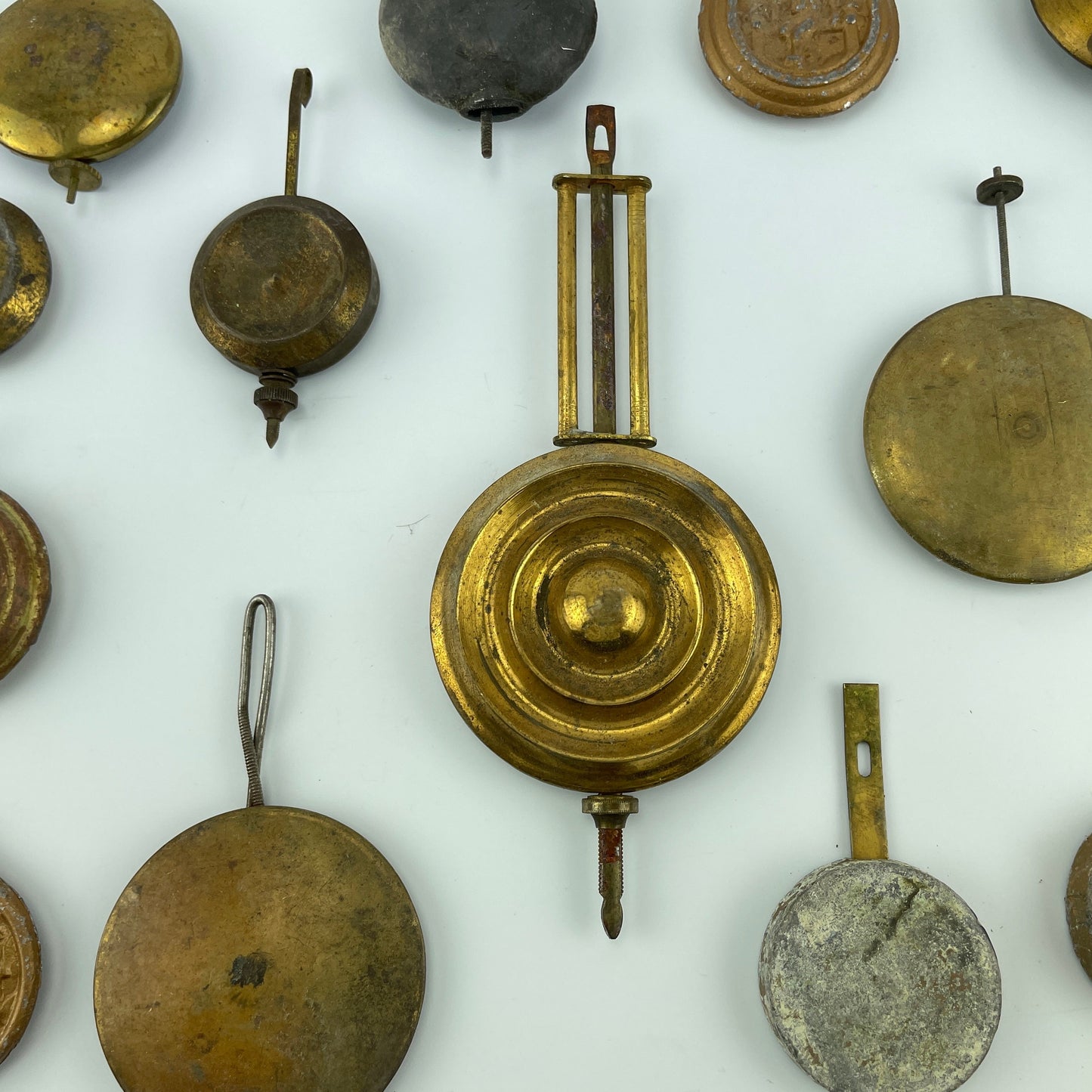 Lot 81- Clock Pendulum Assortment of 18