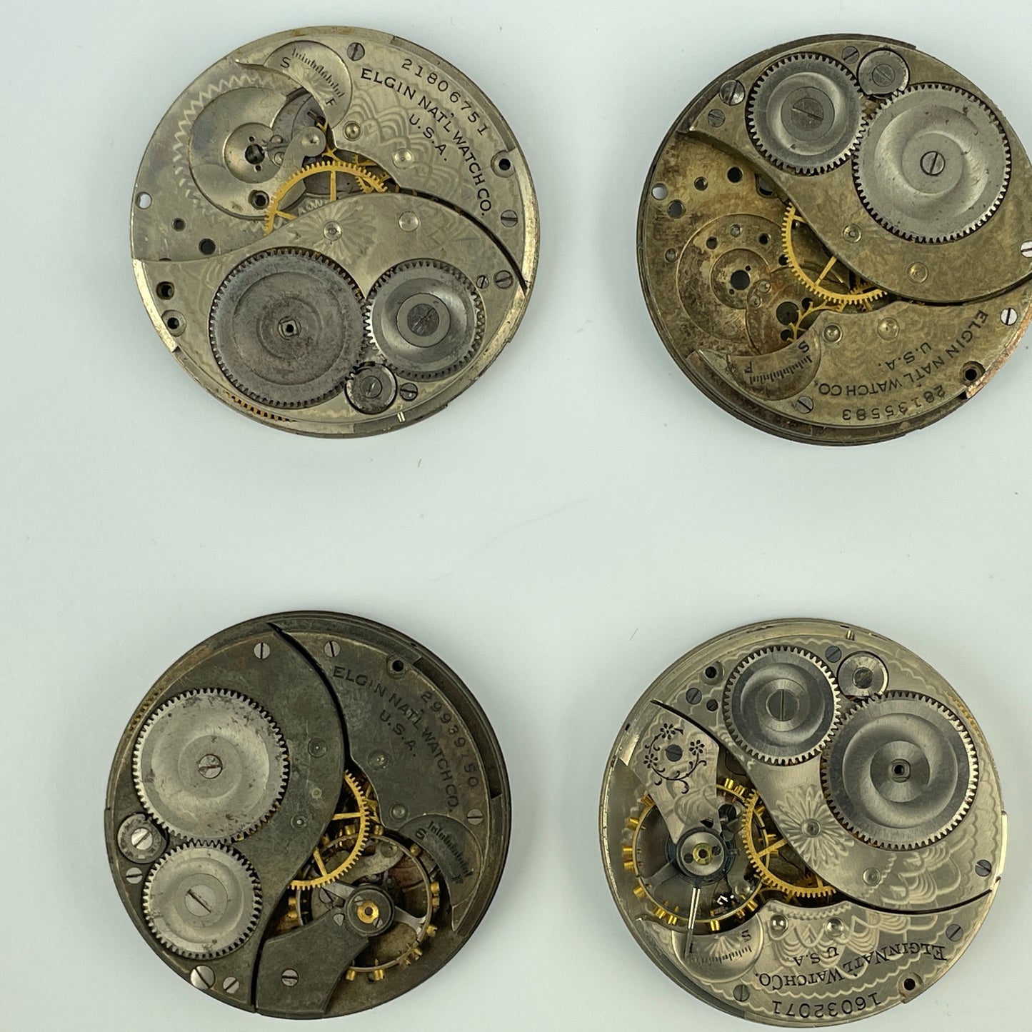 Lot 54- Elgin 12 Size Partial Nickel Pocket Watch Movements