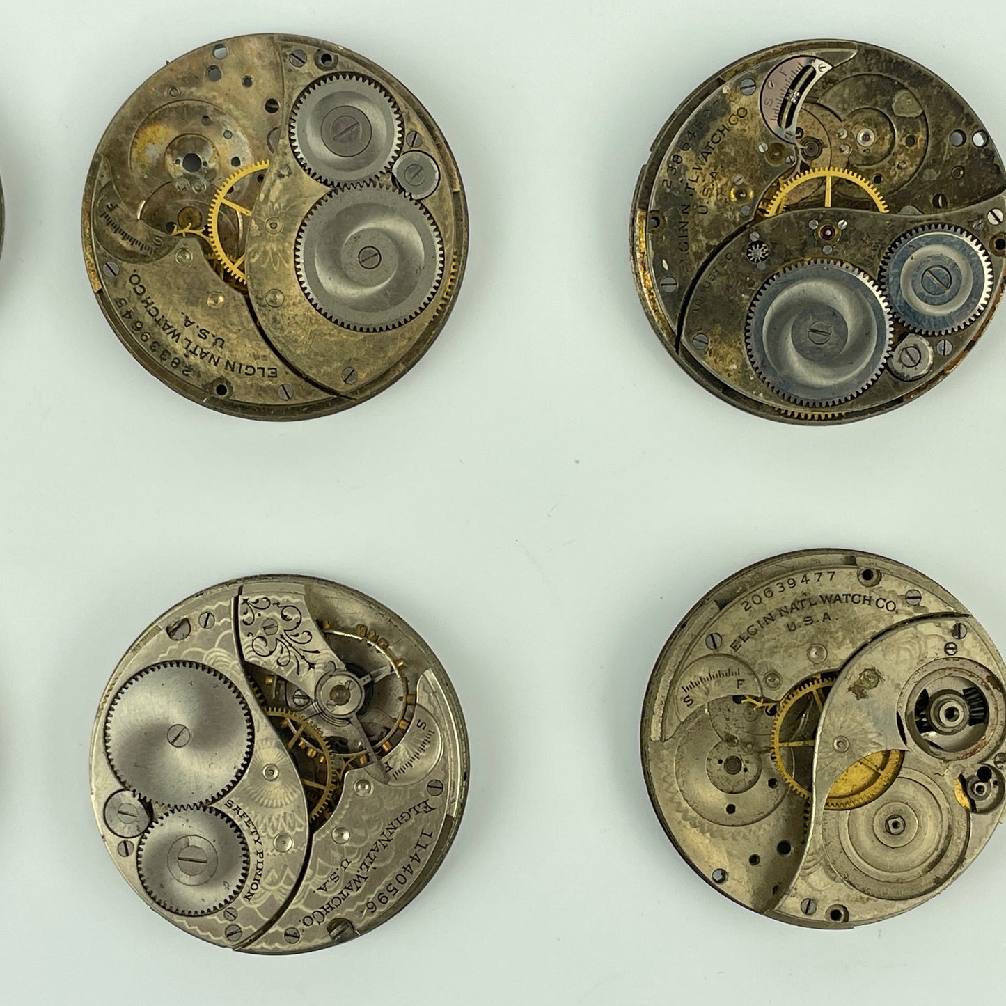 Lot 54- Elgin 12 Size Partial Nickel Pocket Watch Movements