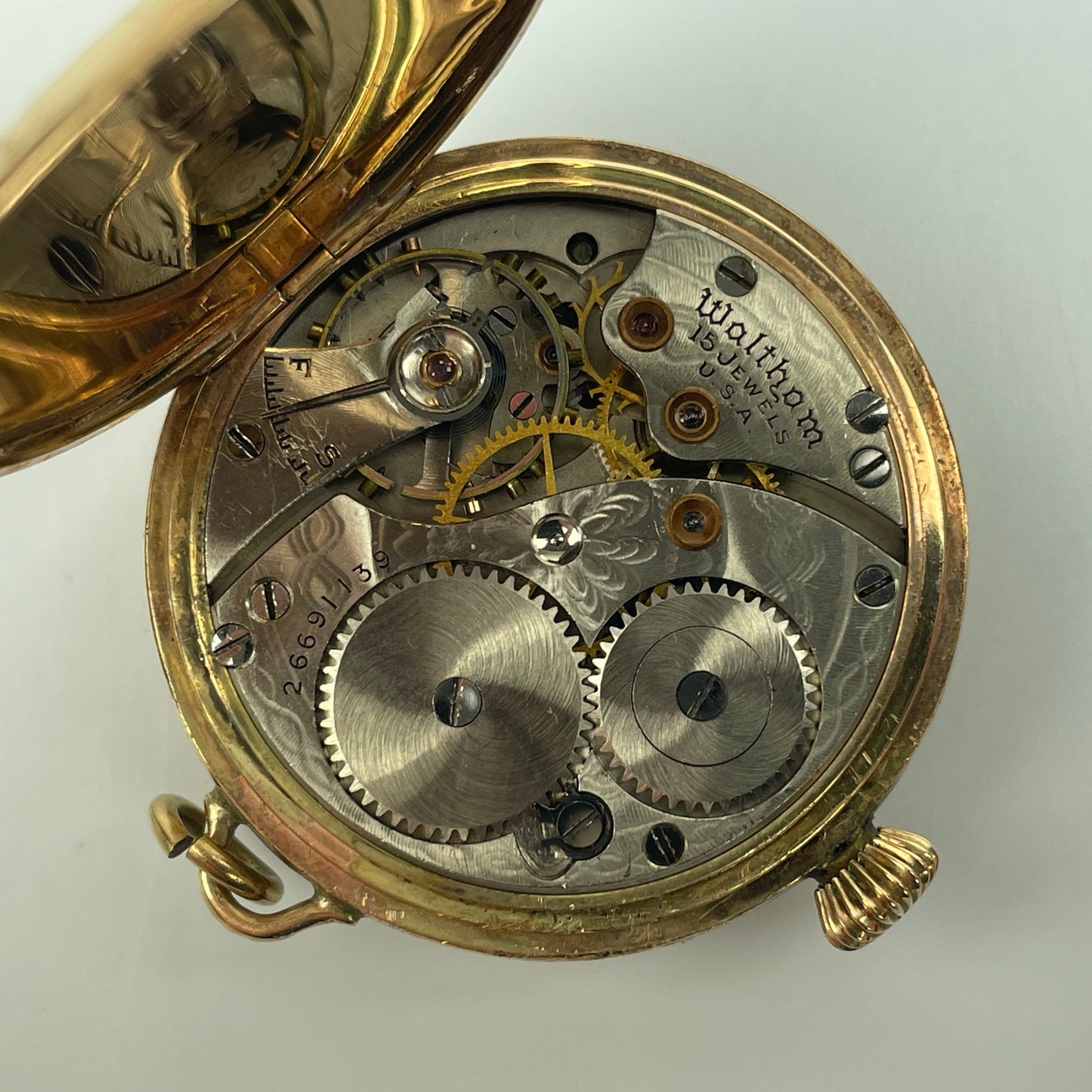 Lot 113- Waltham Early YGF “Braille” Lapel Watch