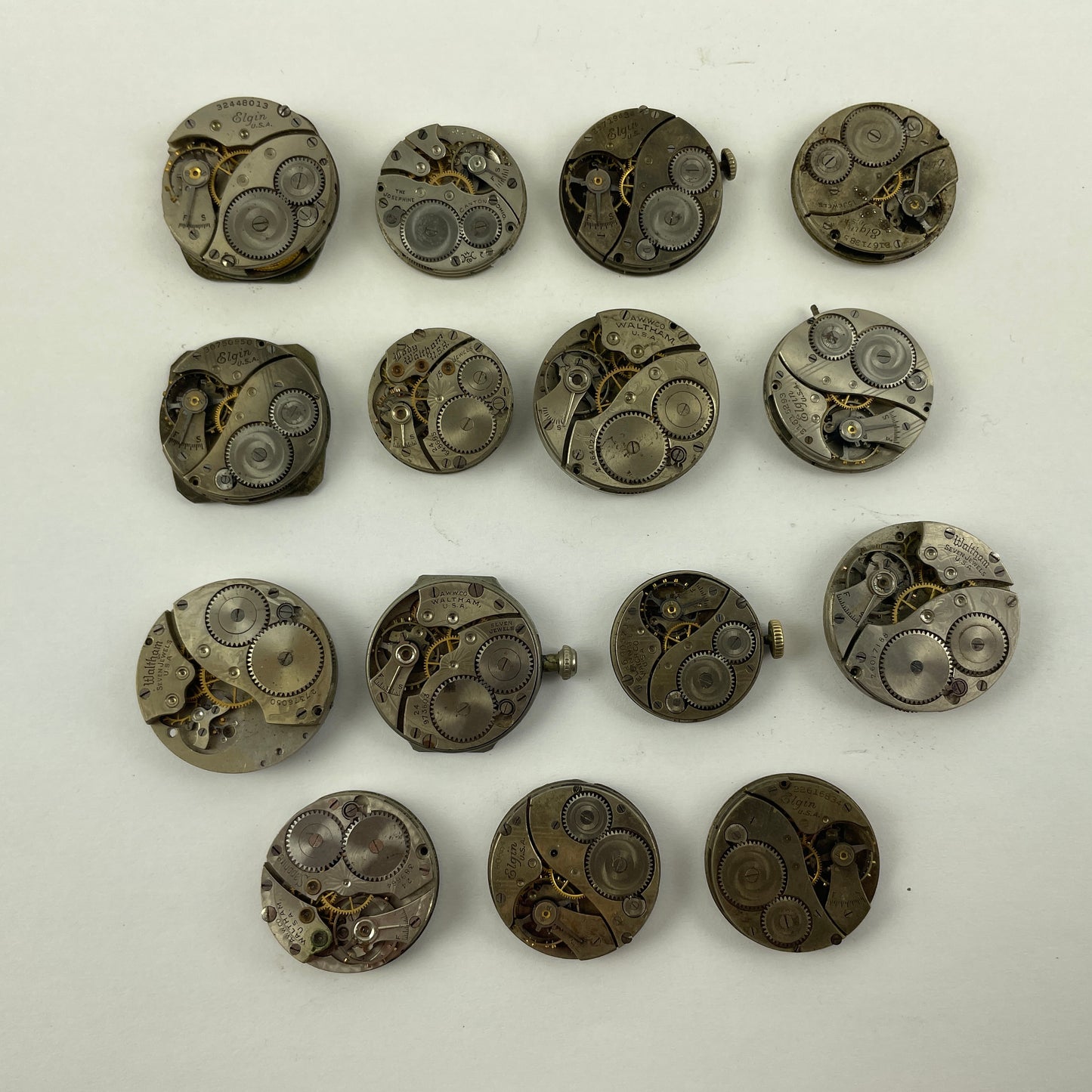 Lot 131- Waltham & Elgin Lapel & Wristwatch Movements