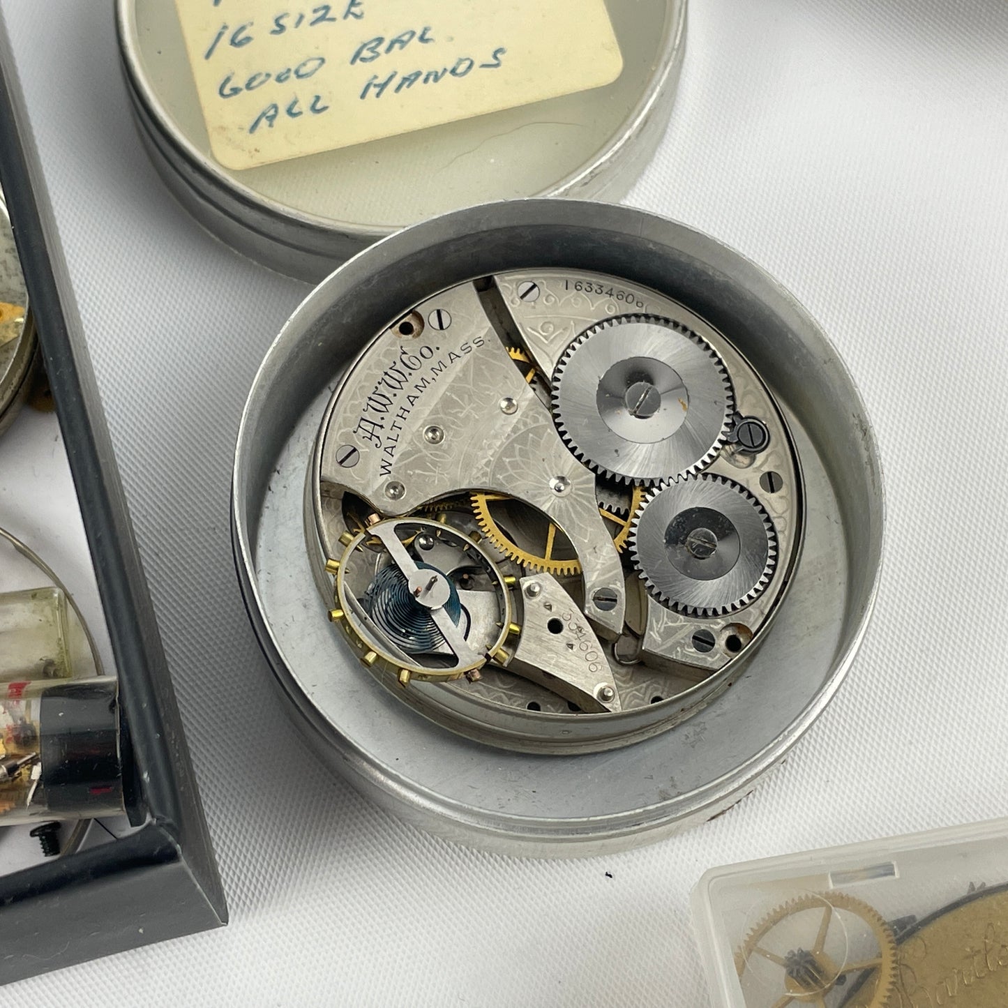 Lot 52- Assortment of Pocket Watch Movements, Wristwatch Stems, Crowns, etc.