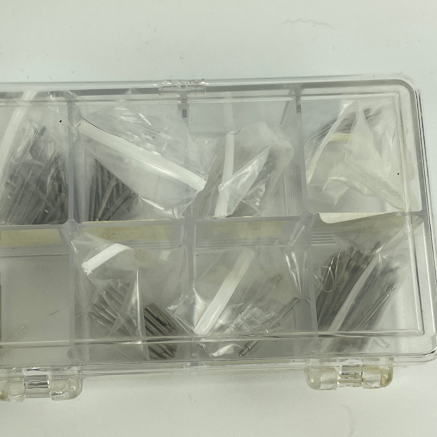 Lot 52- Assortment of Pocket Watch Movements, Wristwatch Stems, Crowns, etc.