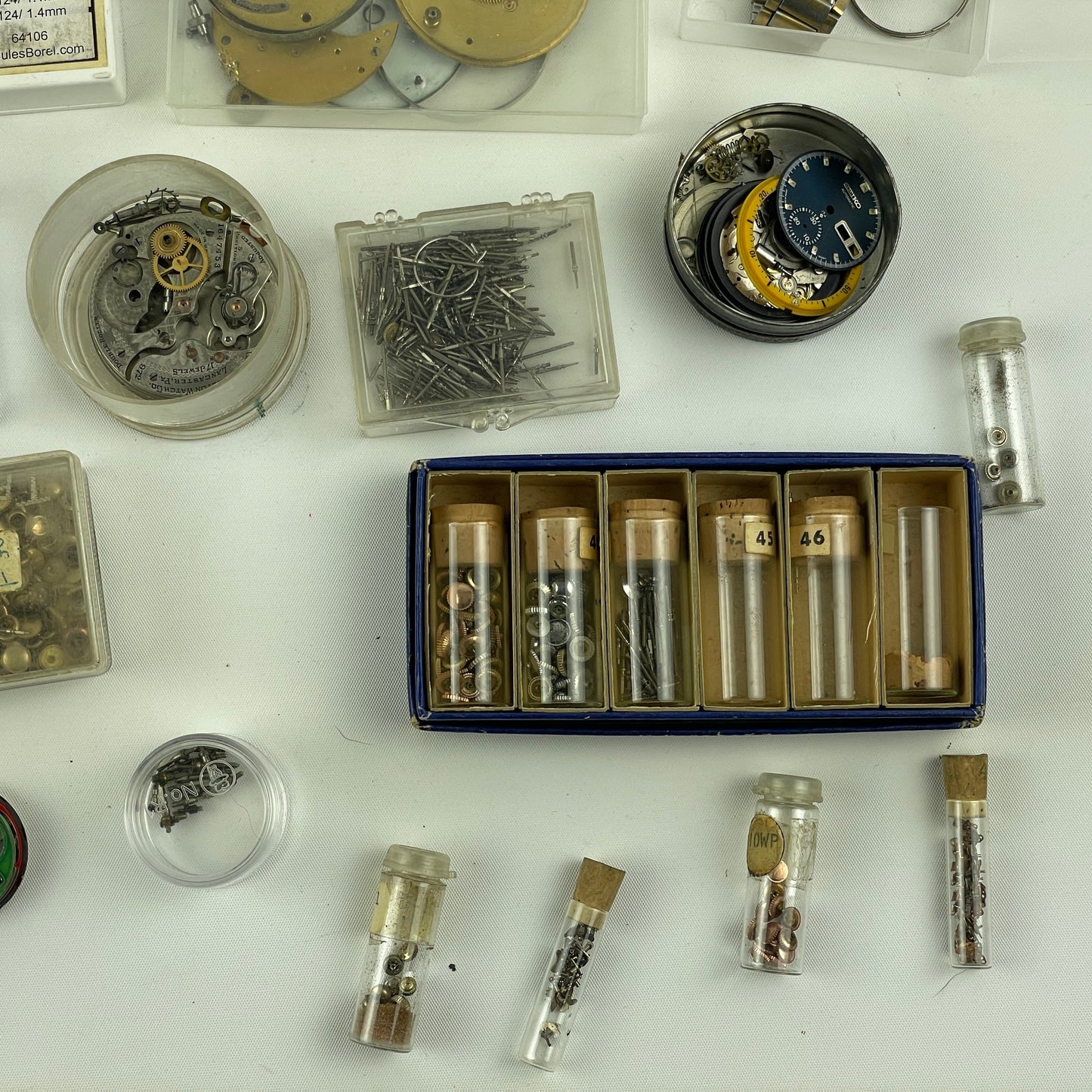 Lot 52- Assortment of Pocket Watch Movements, Wristwatch Stems, Crowns, etc.
