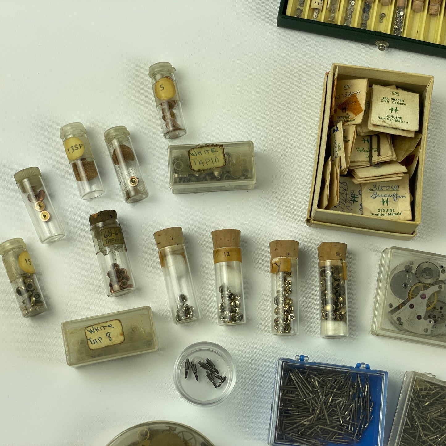 Lot 52- Assortment of Pocket Watch Movements, Wristwatch Stems, Crowns, etc.
