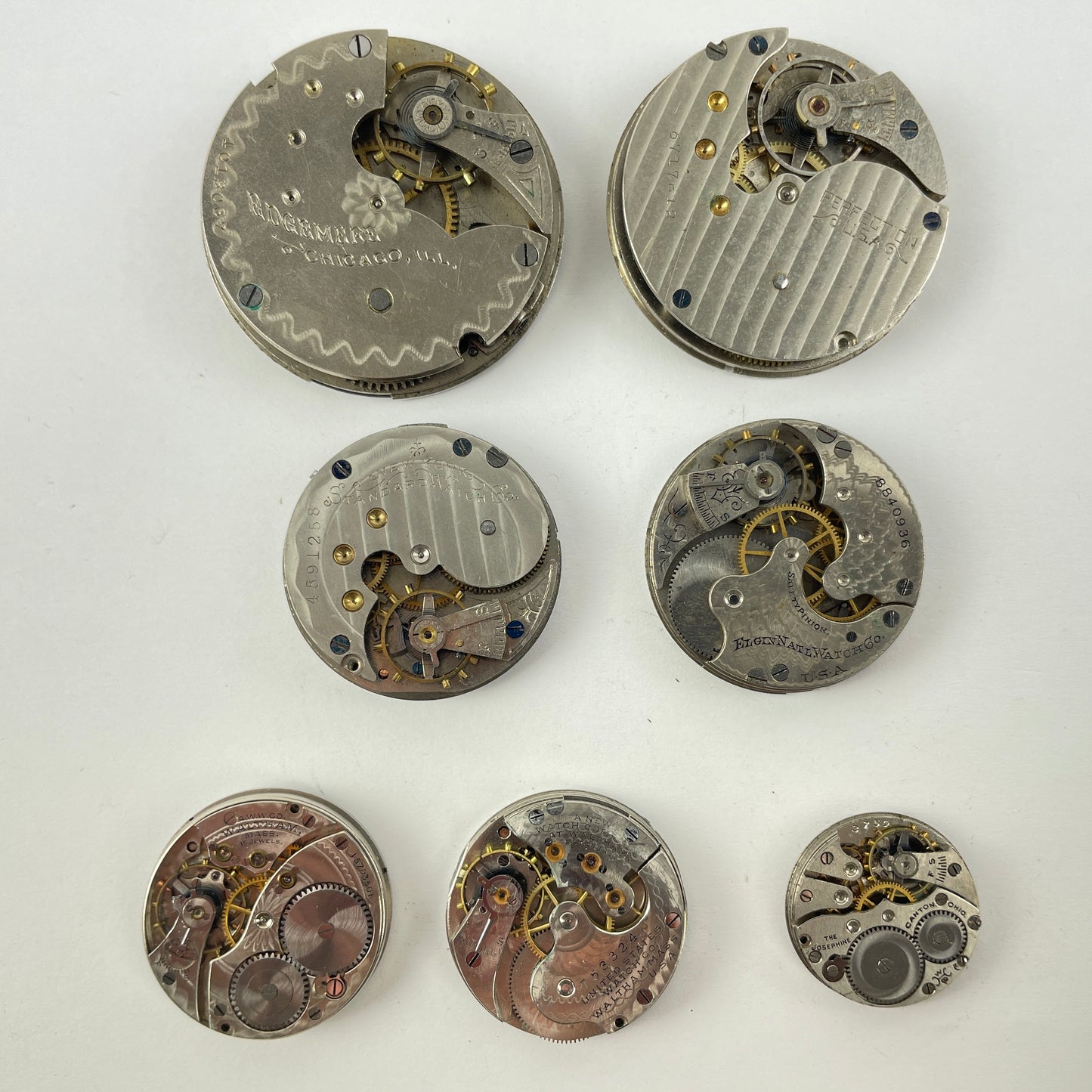 Lot 27- Elgin | Hampden | Waltham Pocket Watch Movement Assortment