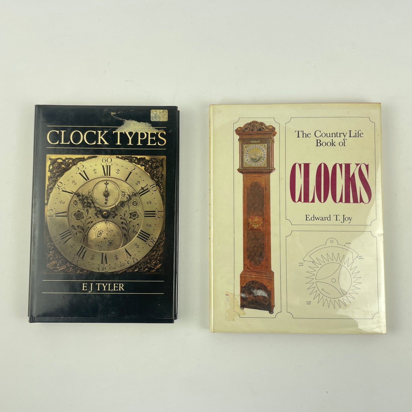 Lot 99- Set of 2 Clock Books