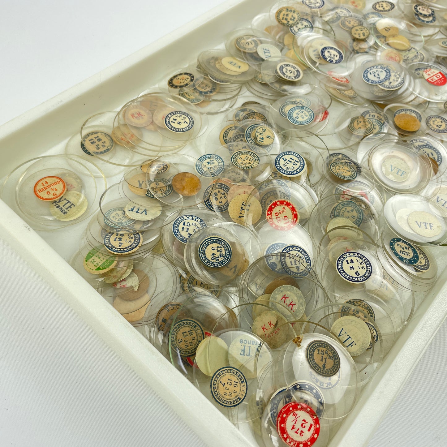 Lot 108- Watchmaker’s Selection of 300 Glass NOS Pocket Watch Crystals