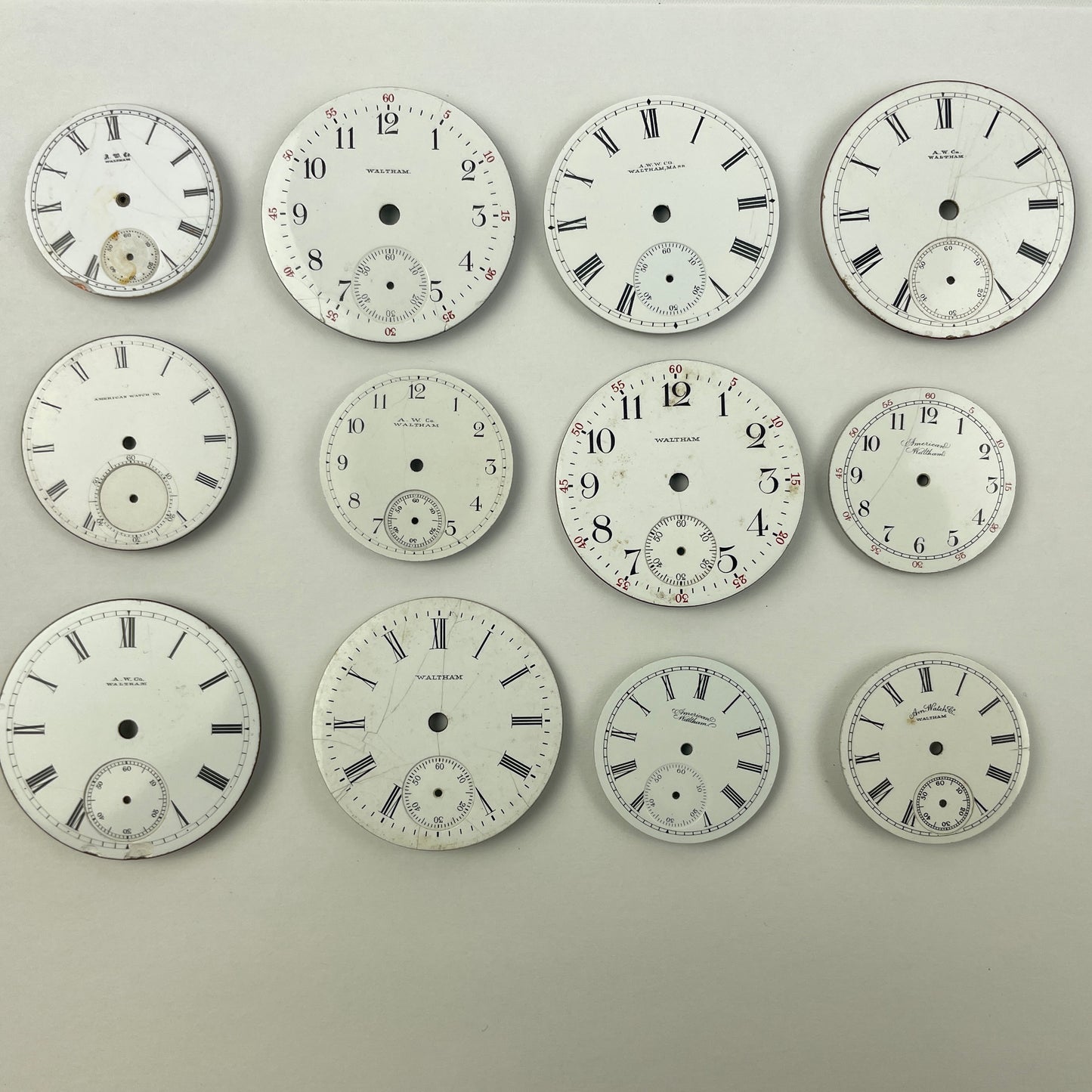 Apr Lot 26- Waltham Assortment of 12 Enamel Pocket Watch Dials