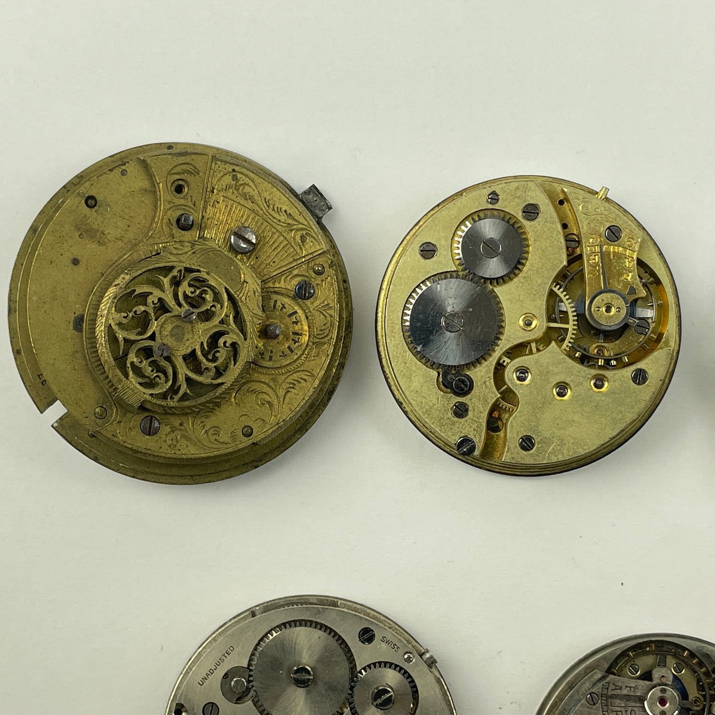 Apr Lot 125-Swiss & English Assortment of 7 Gilt & Nickel Pocket Watch Movements