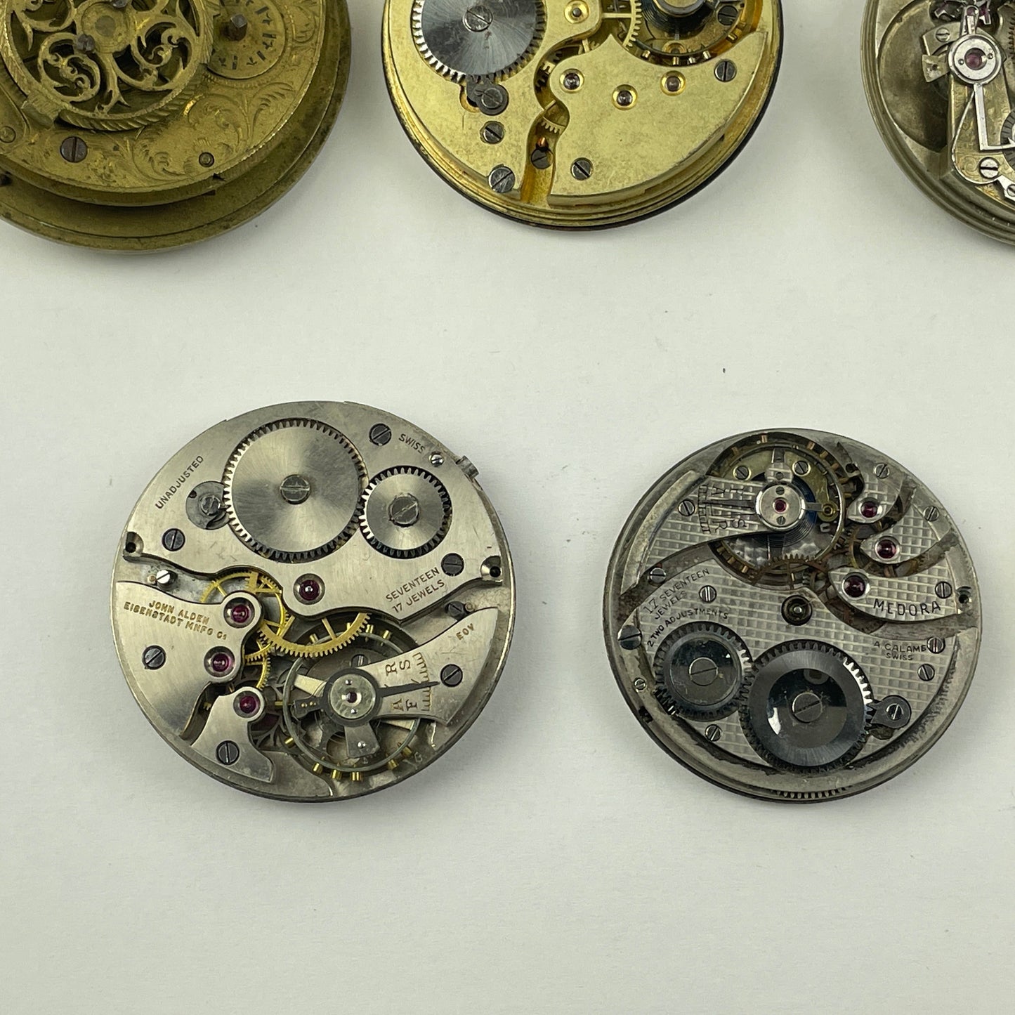 Apr Lot 125-Swiss & English Assortment of 7 Gilt & Nickel Pocket Watch Movements