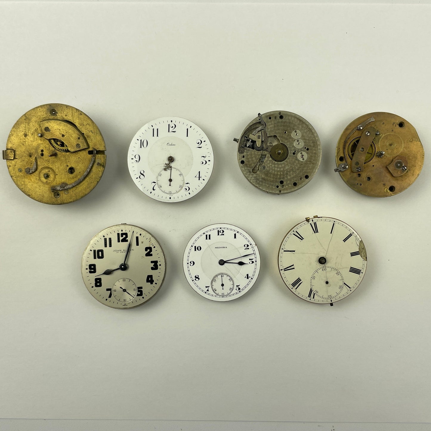 Apr Lot 125-Swiss & English Assortment of 7 Gilt & Nickel Pocket Watch Movements