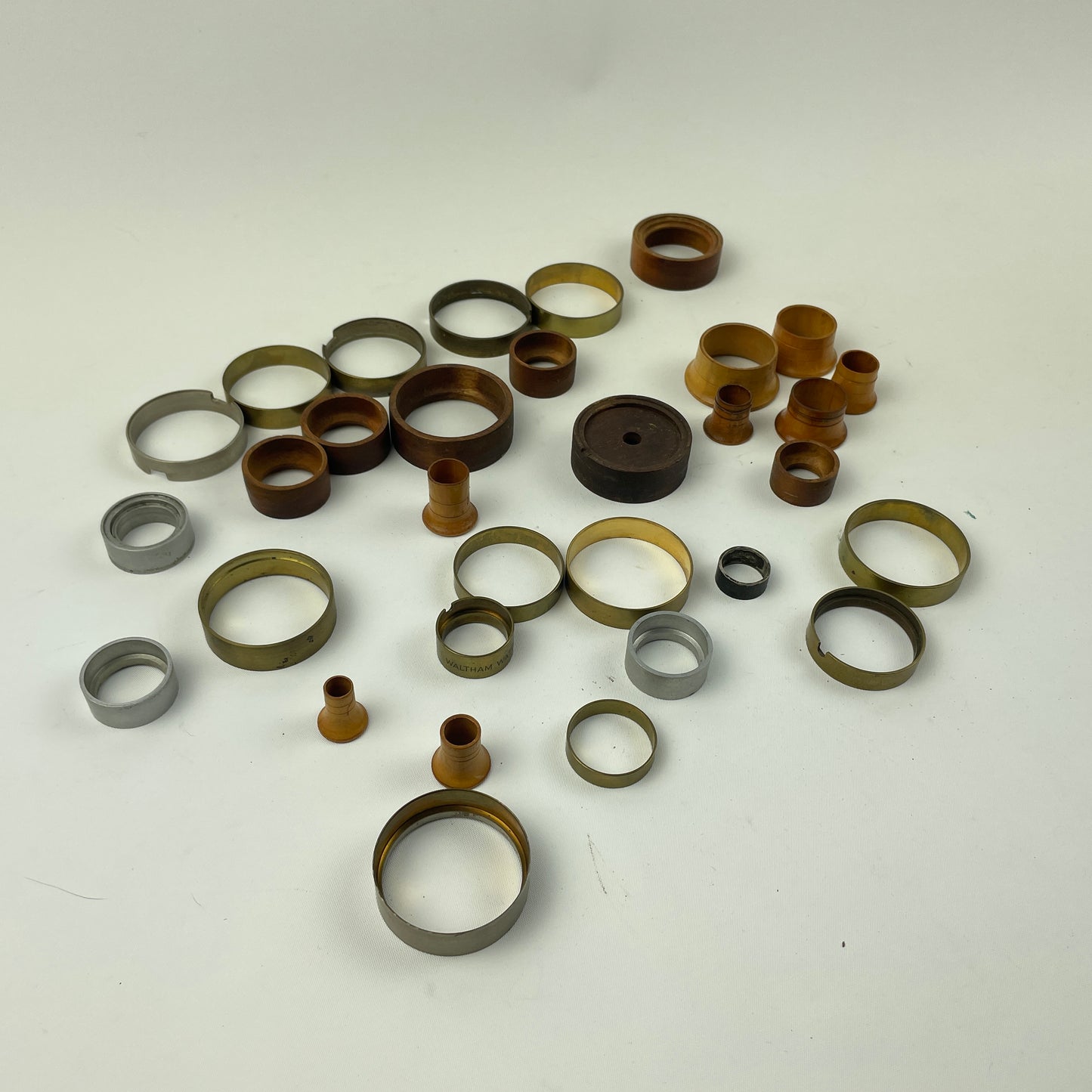 Apr Lot 38- Watchmaker’s Wood, Brass & Aluminum Lapel to Pocket Watch Movement Holders