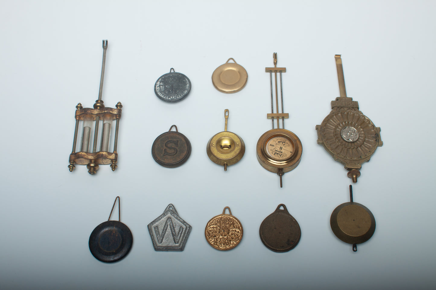 Lot 88- Clock Pendulum Assortment