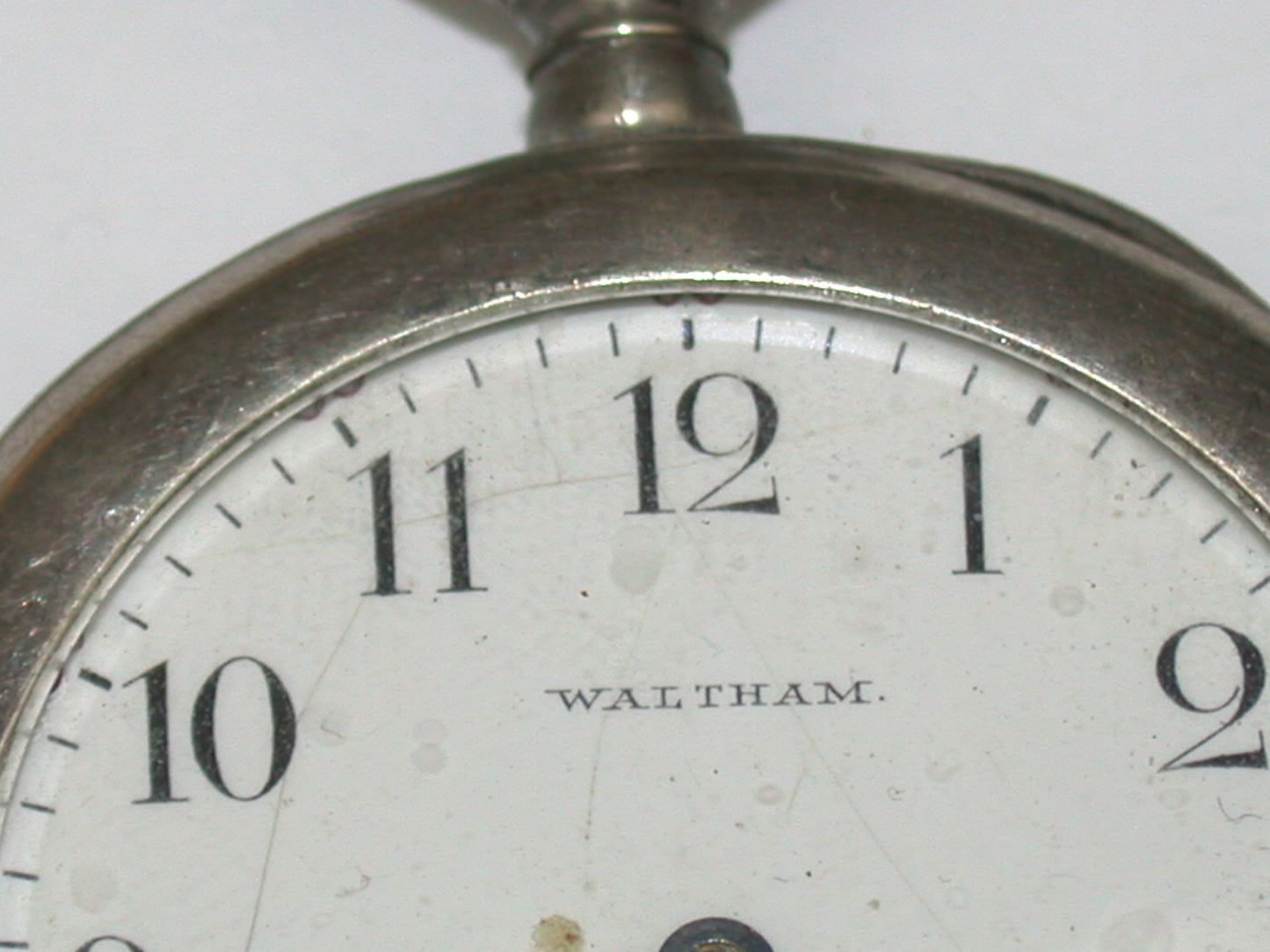 Lot 8- Three American & Swiss Silver & Metal Lapel or Ladies' Pocket Watches