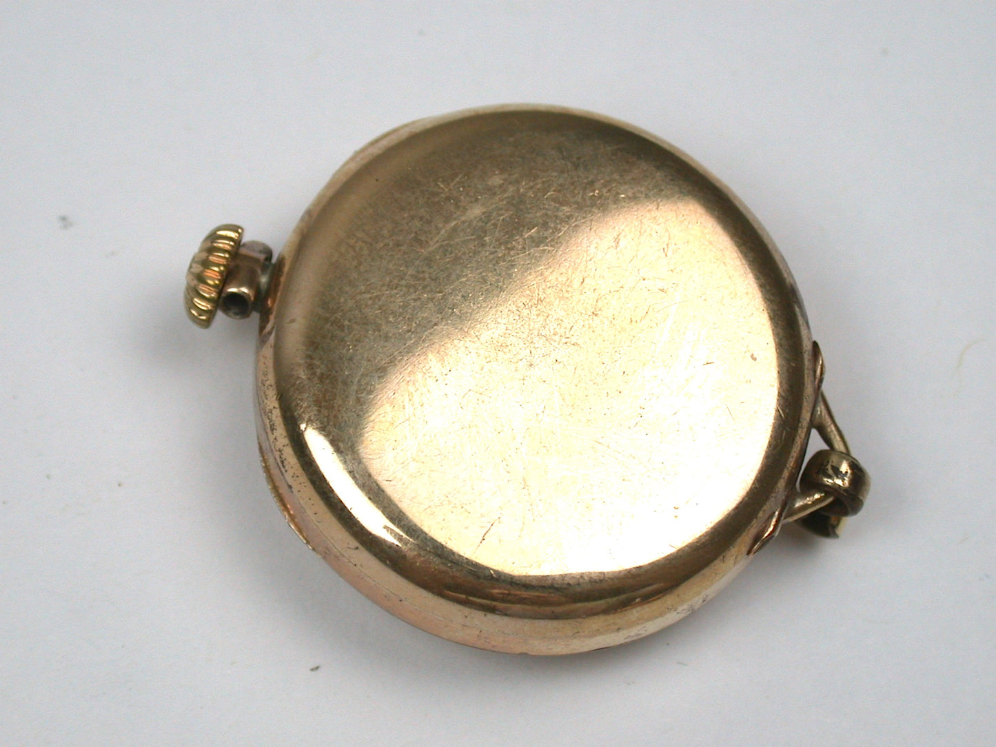 Lot 6- Three Elgin Yellow Gold-Filled Lapel Watches & Wristwatch