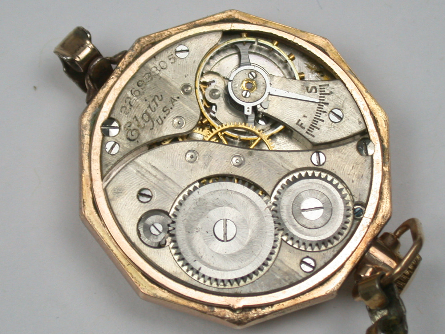 Lot 6- Three Elgin Yellow Gold-Filled Lapel Watches & Wristwatch
