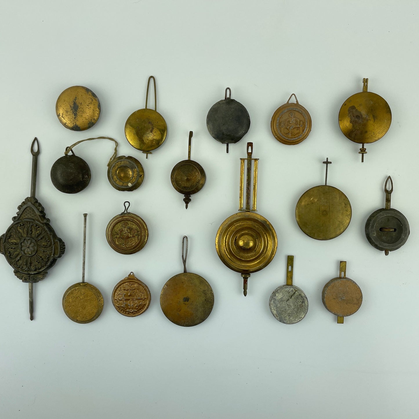 Lot 81- Clock Pendulum Assortment of 18