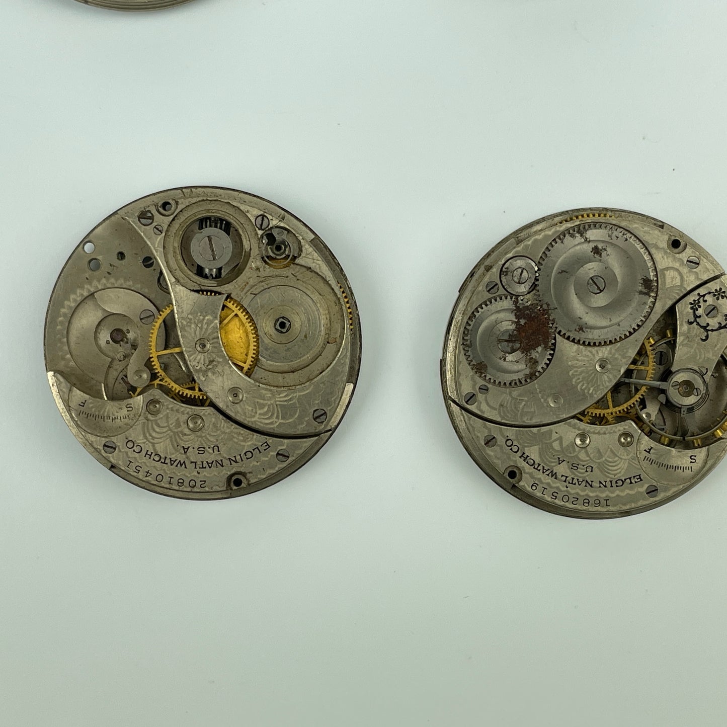 Lot 54- Elgin 12 Size Partial Nickel Pocket Watch Movements