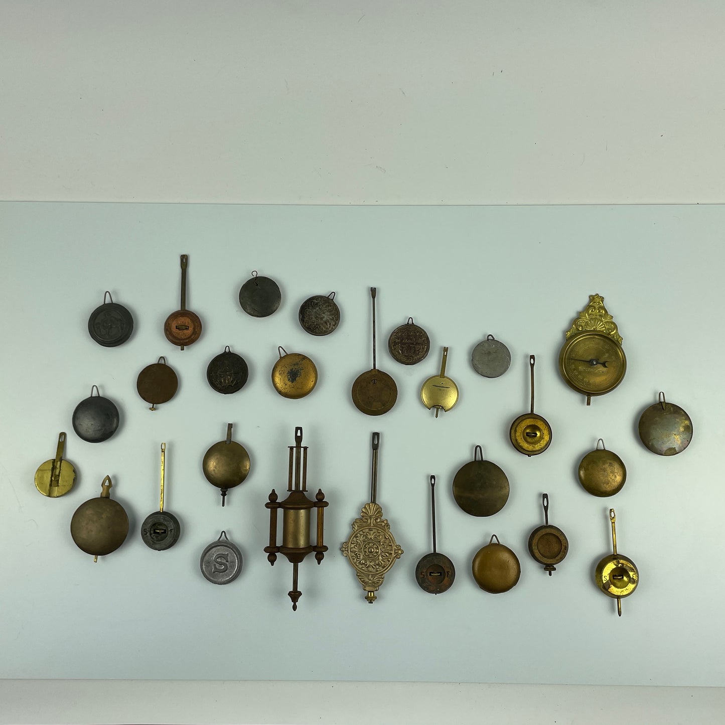 Lot 104- Clock Pendulum Assortment