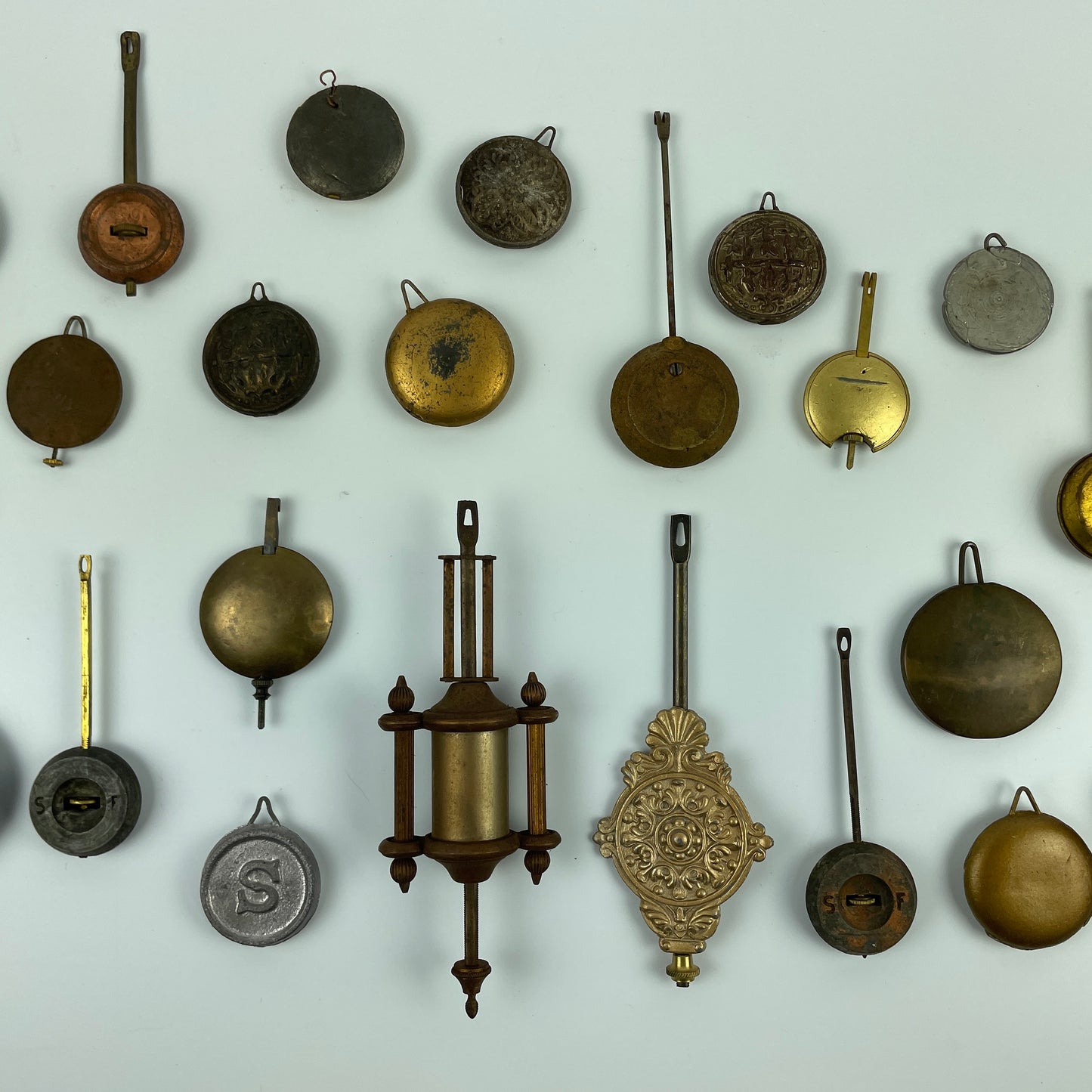 Lot 104- Clock Pendulum Assortment