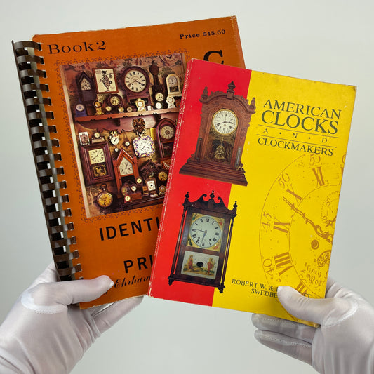 Nov Lot 26- Clock Books set of (2)