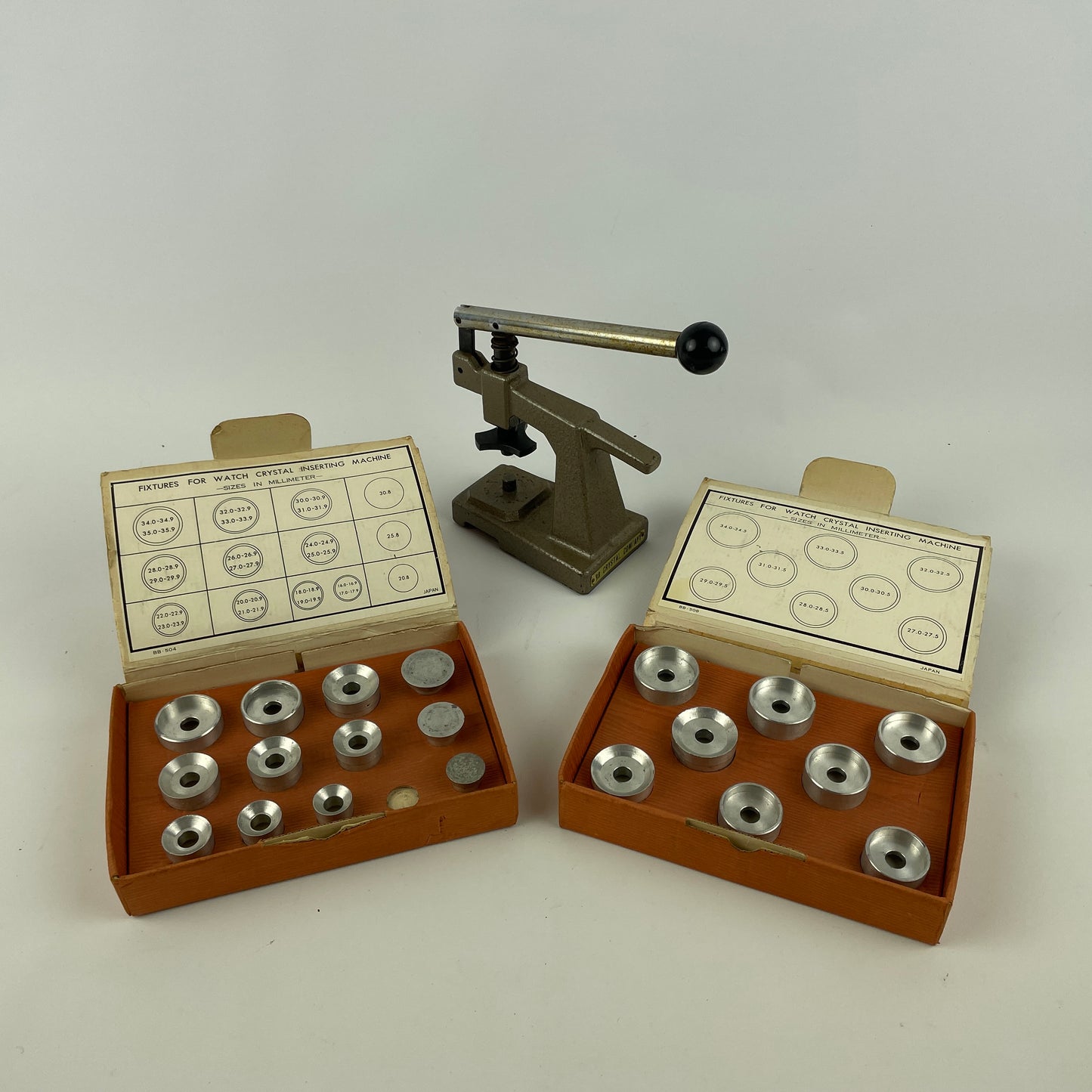 Jan Lot 52- Watchmaker’s Bench top Crystal Machine with Two Boxes of Metal Dies
