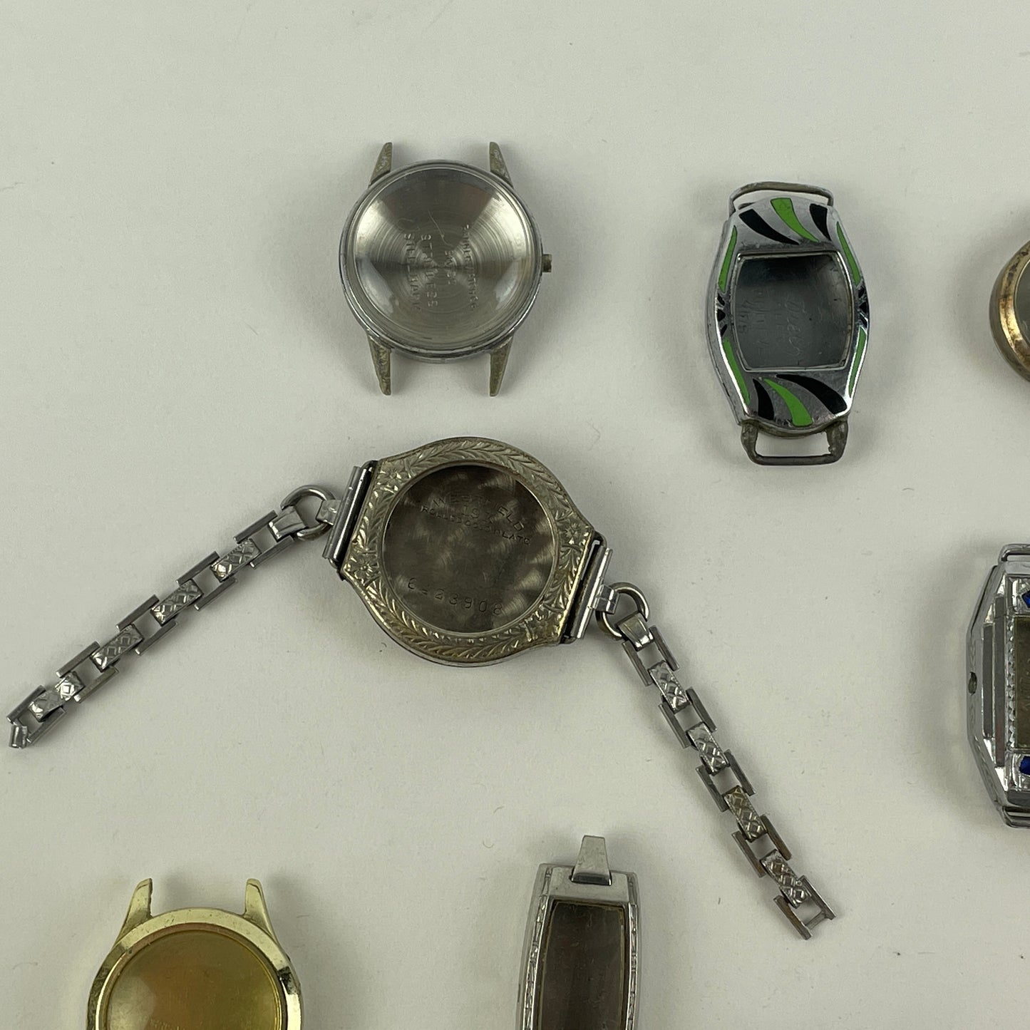 Jan Lot 65- Eighteen Ladie's Vintage Fancy Metal & White RGP Wristwatch Cases