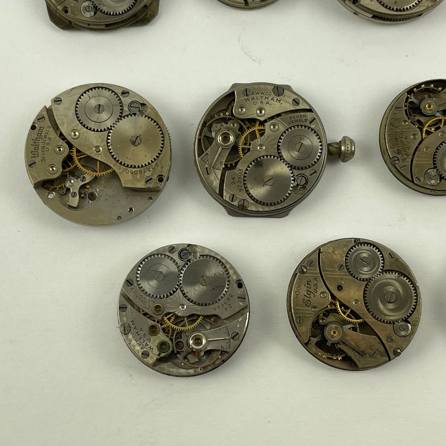 Lot 131-  Waltham & Elgin Lapel & Wristwatch Movements