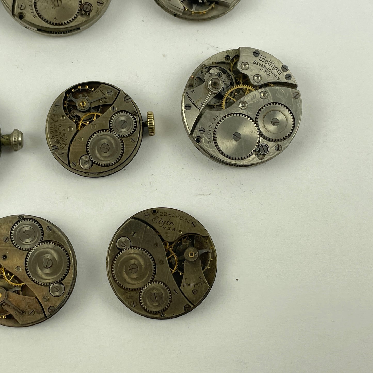 Lot 131-  Waltham & Elgin Lapel & Wristwatch Movements