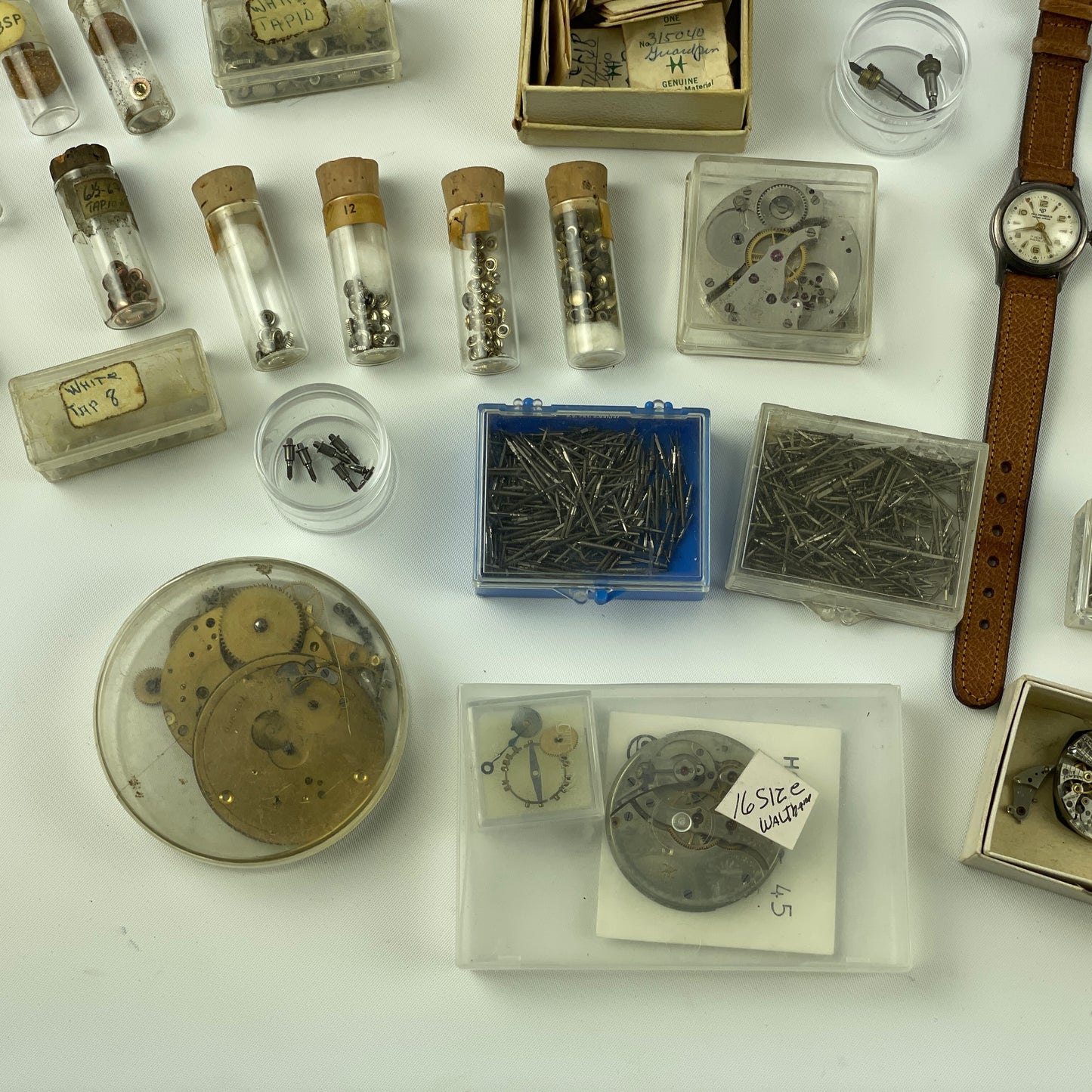 Lot 52- Assortment of Pocket Watch Movements, Wristwatch Stems, Crowns, etc.