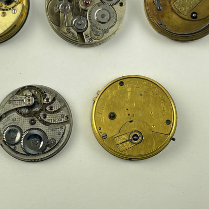 Apr Lot 125-Swiss & English Assortment of 7 Gilt & Nickel Pocket Watch Movements