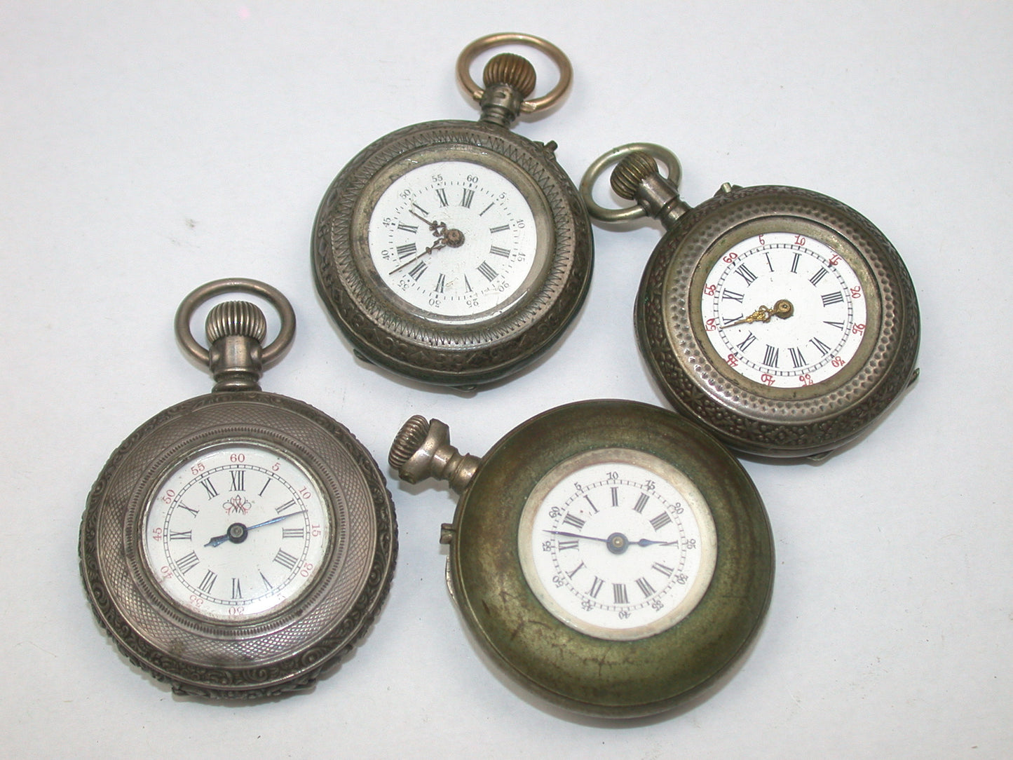 Lot 26- Assortment of Four Swiss & Waltham Ladies' Lapel Watches